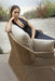 Lady sitting on the Calyxto Love Seat
