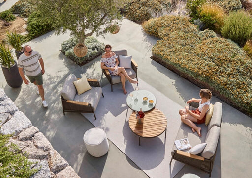 Scoop Outdoor Lounge set with people enjoying a sunny day